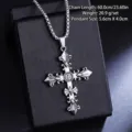 Detailed view of a vintage titanium steel cross pendant necklace on a black display box. - Carved Cross Necklace (08464) / Chain Length 60cm / Antique Silver
