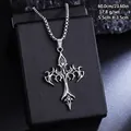 Detailed macro view of a vintage gothic tribal cross pendant in silver steel. - Totem Texture Cross Necklace (08488) / Chain Length 60cm / Antique Silver