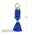 Blue handmade bohemian macrame tassel keychain featuring a gold heart clasp and evil eye - Blue