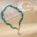 Detailed view of turquoise stone necklace with baroque pearl and OT clasp - Necklace