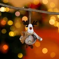 Plush reindeer Christmas ornament with plaid body and gold scarf hanging on a branch - Coffee Deer