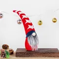 Patriotic faceless gnome plush doll featuring a star pattern hat on a rustic wooden stand - Red White Stripes With Star / Style 1