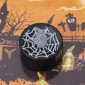 Close-up of a black LED tea light candle with a spider web print for Halloween party decoration. - Spider Style / Black