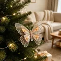 Detailed view of a glittering butterfly ornament clipped on a Christmas tree branch - Netted Butterfly / Set of 3 / Gold