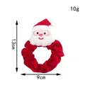 Gedetailleerde weergave van een rode kerstscrunchie met afmetingen van 13cm en 9cm - Rode Kerstman Scrunchie