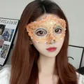 Elegant orange lace masquerade mask with exquisite sequin details for costume parties. - Orange