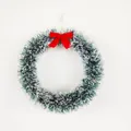 Festive Christmas tinsel wreath featuring white snowy effect and a red bow ornament - Flower Garland / 20cm / White Edge Pink