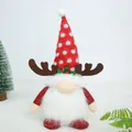 Detailed view of a plush Christmas gnome with reindeer antlers and red polka dot hat - Red