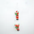 Close-up of two Santa Claus dolls climbing a white rope ladder for Christmas decor - Double Santa Claus Ornament / 25cm