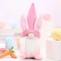 Handmade pink Easter gnome with bunny ears and knitted hat for festive desktop decoration - Sakura Pink