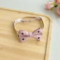 Detailed view of adjustable pink pet collar with floral bow tie and safety buckle - One Size 23-40cm / Pink