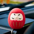 Red traditional Daruma doll car dashboard ornament with paintable eyes for fortune - Red