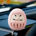 Small pink Japanese Daruma doll mascot for car interior decoration and lucky blessing - Pink