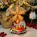 Delicate glowing gingerbread windmill house resin Christmas ornament with music box feature - Gingerbread House Style