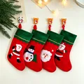 Lot de quatre chaussettes de Noël colorées avec motifs de père Noël et bonhomme de neige. - Style Bord Vert (Motif Aléatoire)