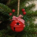 Festive red Christmas bell ornament with a checkered bow and berries on a tree - Red Round Bell