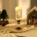 Detailed close-up view of a lit Christmas water candle featuring a Santa Claus snow globe scene - Santa Holding Tree Style / Brushed Gold
