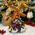 Decorative Christmas snow house resin windmill with warm LED lights in a winter scene - Brown Wood Cabin Style