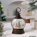 Close-up of festive snow globe lantern with a Christmas tree and colorful gifts. - Christmas Tree