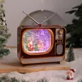 Retro TV Weihnachts-Schneekugel-Spieluhr mit leuchtender Szene und Nikolaus - Bunter Fernseher Rentier Schlitten Stil