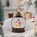 Vintage gold Christmas snow globe lantern with snowman and reindeer scenery - Snowman