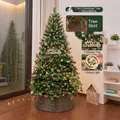 1.5m pre-lit Christmas tree set with pine cones, red berries, and a woven base surround. - Wood Sign Pinecone Style (1.5m) / With Lights and Tree Skirt / Forest Green
