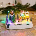 Festive illuminated Christmas village music box with flying Santa and colorful LED lights - Santa Flying Deer Style