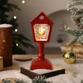 Detail view of a red retro mailbox Christmas water lantern with Santa and swirling glitter - Red Santa Claus