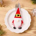 Festive red Christmas gnome cutlery holder with Santa belt for holiday table decoration - Belt Style