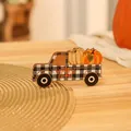 Detailed macro shot of painted wooden truck decoration featuring a grateful heart message - Black and White Plaid Truck
