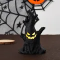 Close-up of Halloween spooky tree stump with a glowing face and graveyard tombstone detail - Small Ghost Tree Trunk / 7.2x5x11.4cm