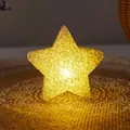 Warm yellow glowing star lamp with textured surface for festive atmosphere decoration. - Handheld / 8cm / Warm Tone
