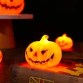Glowing orange LED pumpkin Jack-o-lantern lamp for Halloween party atmospheres - Small (6.3*5.2CM)