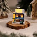 Charming lit resin Christmas house figurine with snow texture and warm LED glowing light - Style G