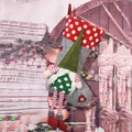 Detail view of a grey Christmas stocking featuring a handmade plush gnome ornament. - Long Leg with Braids