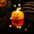 Close-up of a warm glowing Halloween LED pumpkin light decoration with spooky face design - Orange Pumpkin