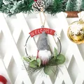 Close-up detail of a Christmas gnome wreath featuring a Welcome banner and greenery - Grey Hat Gnome Door Hanging
