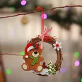 Close-up view of a Christmas wreath hanging ornament featuring a cute felt teddy bear - Bear Style