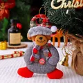 Plush fabric Christmas bear doll ornament wearing a red checkered scarf and Santa hat - Button Bear