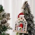Detailed view of a wooden house-shaped gnome pendant hanging on a snowy Christmas tree. - Christmas Tree