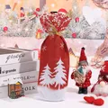 Festive red Christmas wine bottle bag with white tree and snowflake patterns. - Red