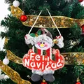 Plush snowman Christmas ornament with Feliz Navidad sign hanging on a decorated tree - Tag Snowman Style