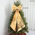 Large shimmering golden Christmas tree bow topper ornament for holiday home decoration - 110 cm / Gold