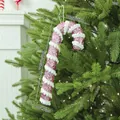 Sparkling pink foam Christmas candy cane ornament showing dimensions on a green tree - Large Candy Cane / Pink
