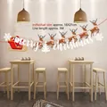 Détail de la bannière de Noël en papier avec Père Noël et rennes pour décoration festive - Style Créatif Z-7