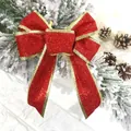 Sparkly red 12cm Christmas bow with gold trim decoration on snowy pine background - 12CM Width / Red
