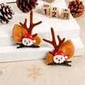 Close-up of cute Christmas reindeer antler hair clips with Santa Claus - Santa Claus / One Pair / Brown