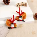 Detail view of festive Christmas reindeer antler hair clips with a cute snowman character - Snowman Style / One Pair / Red