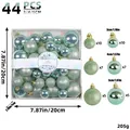 Specifications showing 44 light green ornaments in various sizes with clear box dimensions - 44 Pieces / Cyan