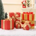 Macro view of assorted red and gold Christmas decorative gift box props for mall display - Set of 7 Figures / Red Box